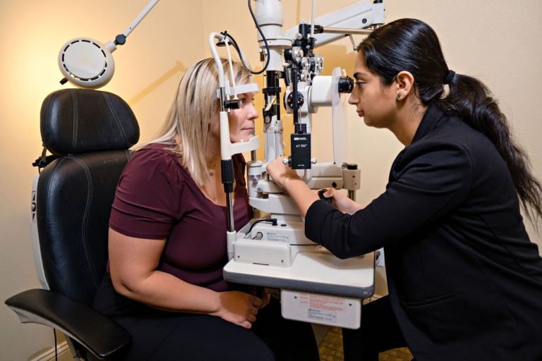 An optometry patient gets her eyes checked at Pritchett Eye Care Associates